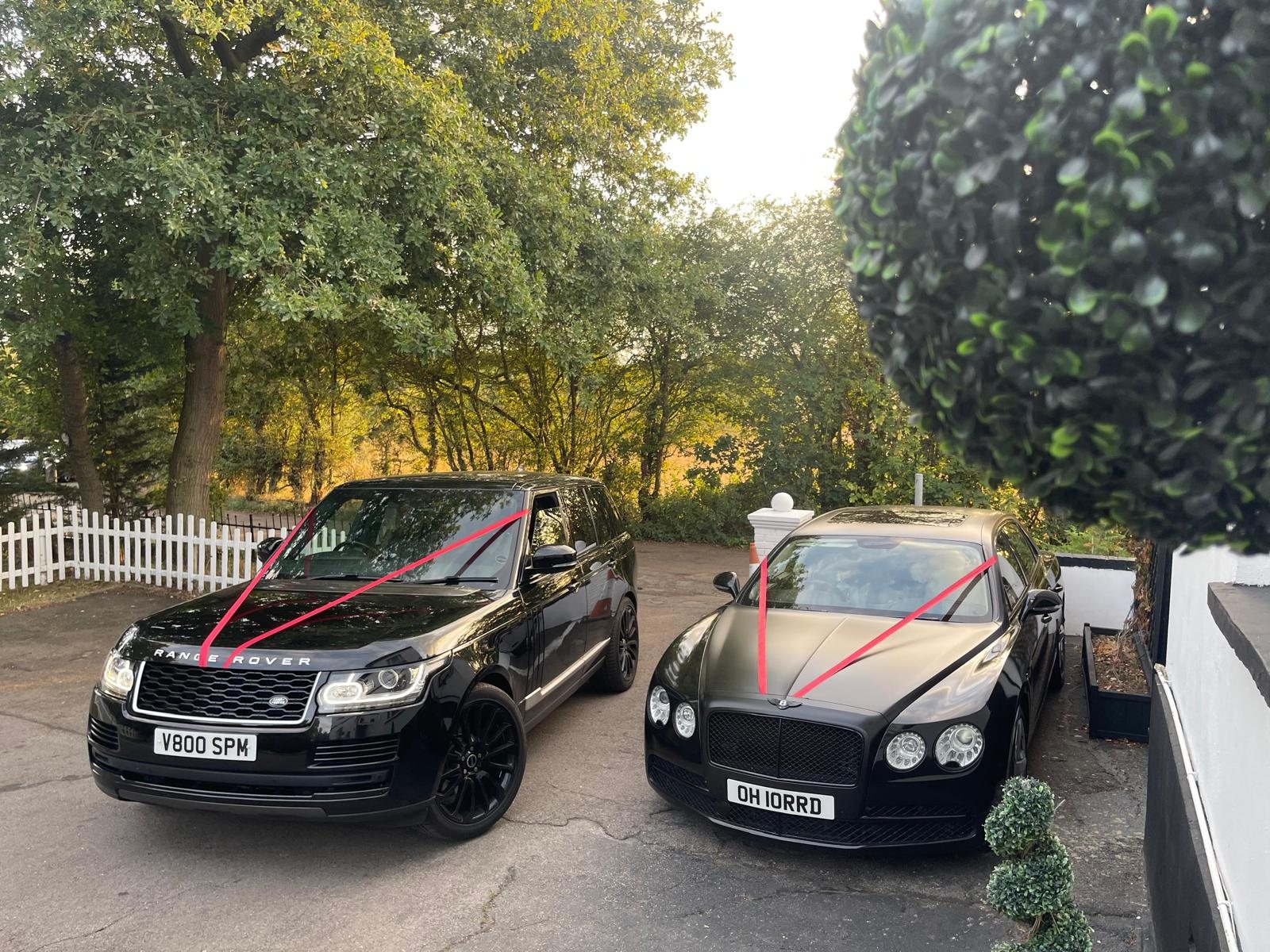 Range Rover and Bentley with red wedding ribbons — Bedford Executive Cars